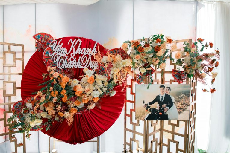 Beautiful floral wedding display with elegant decor and personalized sign indoors.